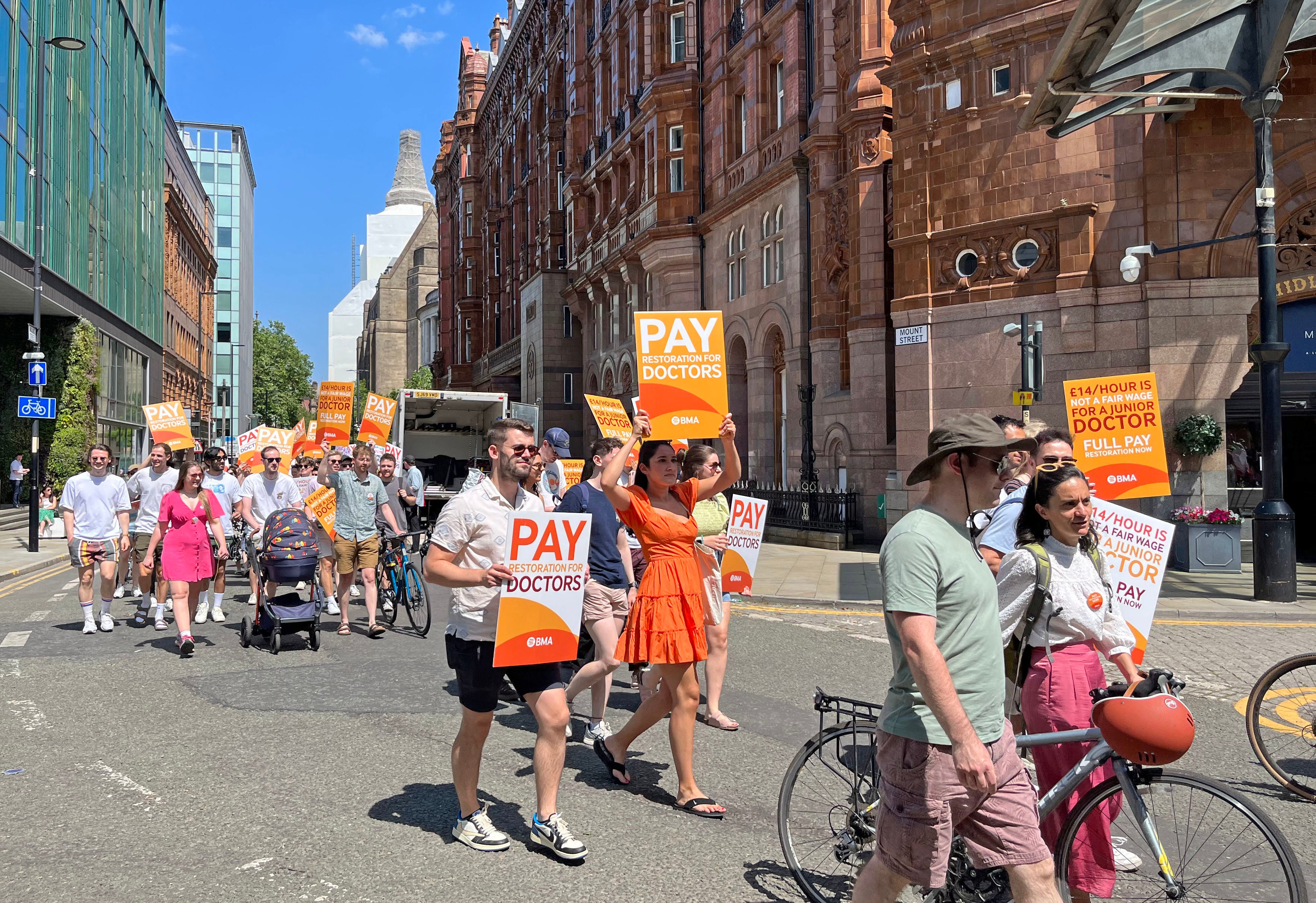 Striking junior doctors march through Manchester during last week’s walkout in a dispute over pay and conditions