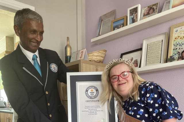Heidi Crowter, 27, from Coventry, was given a certificate by Guinness World Records adjudicator Prav (Mencap/PA)