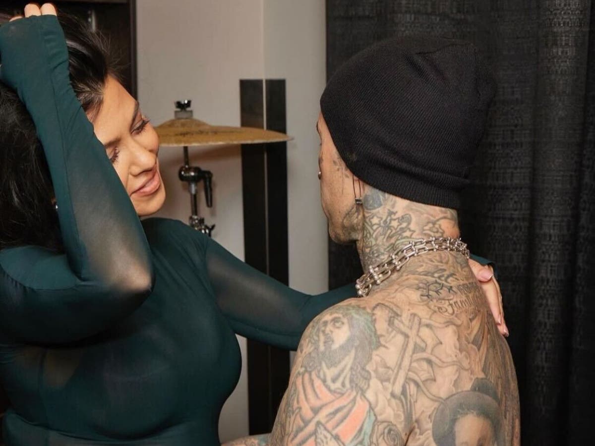 Kourtney Kardashian shares baby bump photos after announcing pregnancy with &lsquo;Travis I&rsquo;m pregnant&rsquo; sign