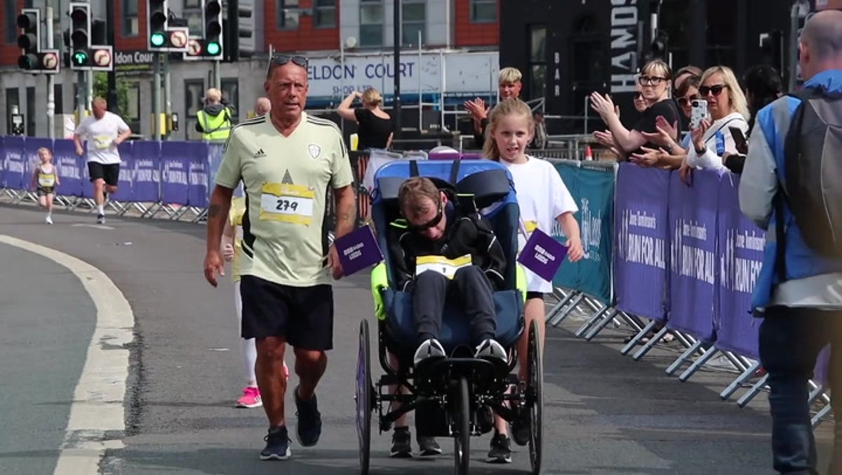 Moment Rob Burrow and his children cross finish line of Father’s Day fun run