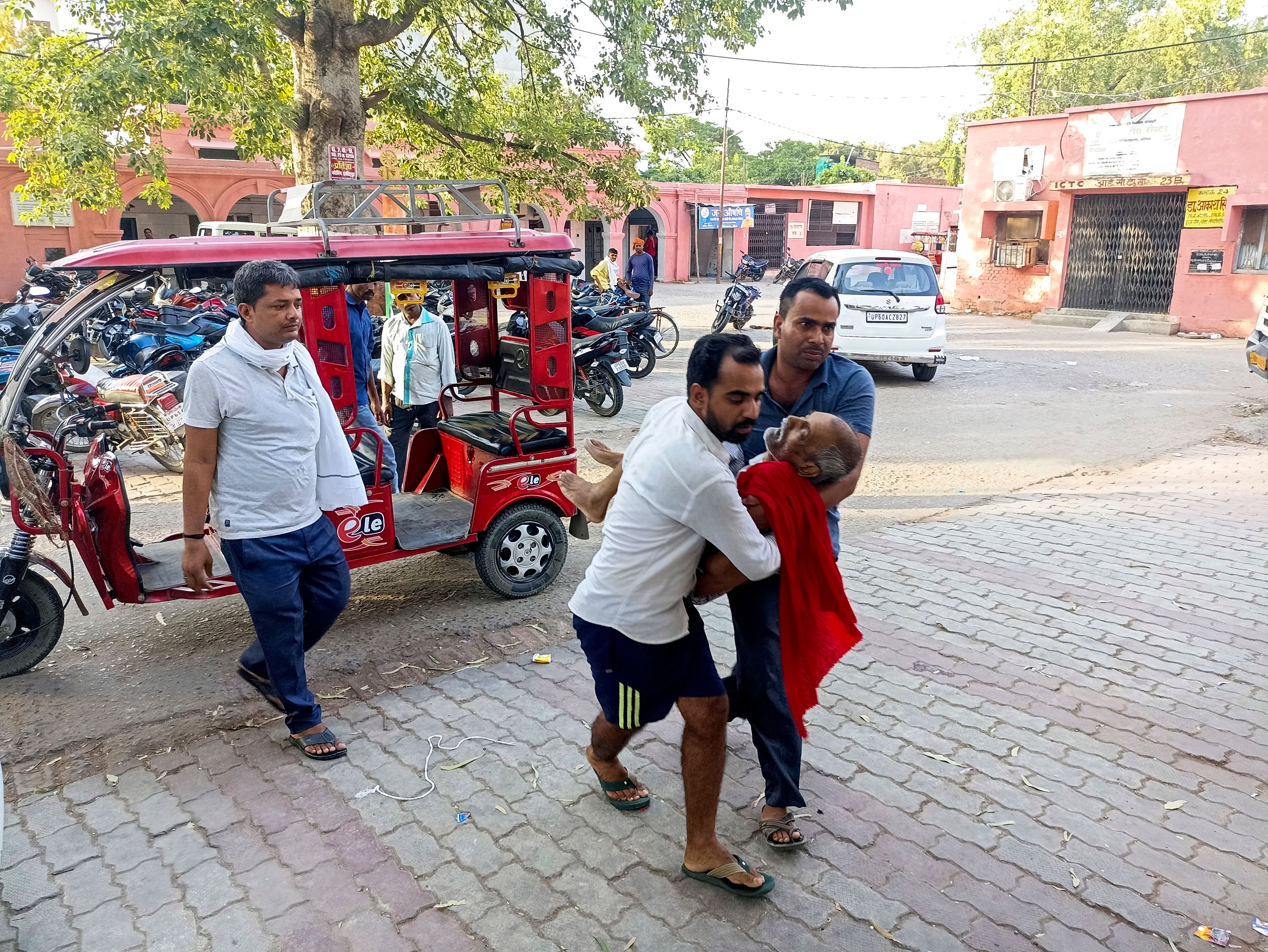An elderly man is carried to a hospital in Ballia district
