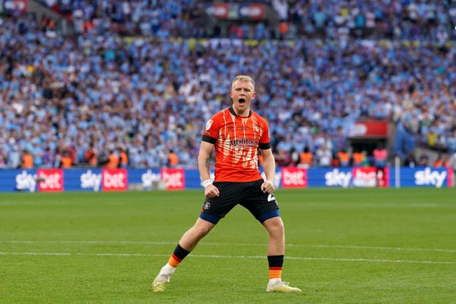 Joe Taylor celebrates after scoring in the Wembley penalty shoot-out that took Luton into the Premier League (Adam Davy/PA)