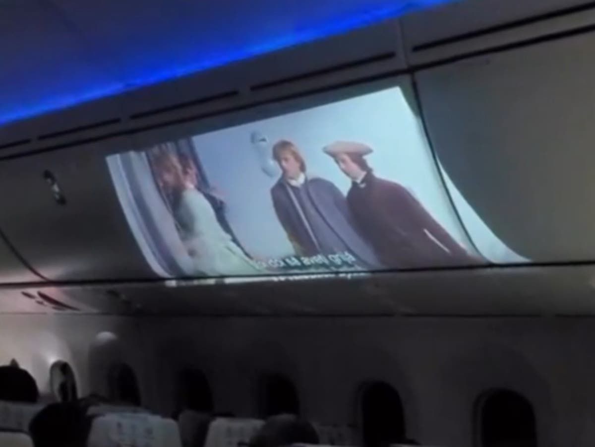 Passenger brings projector on plane and plays film on overhead bin