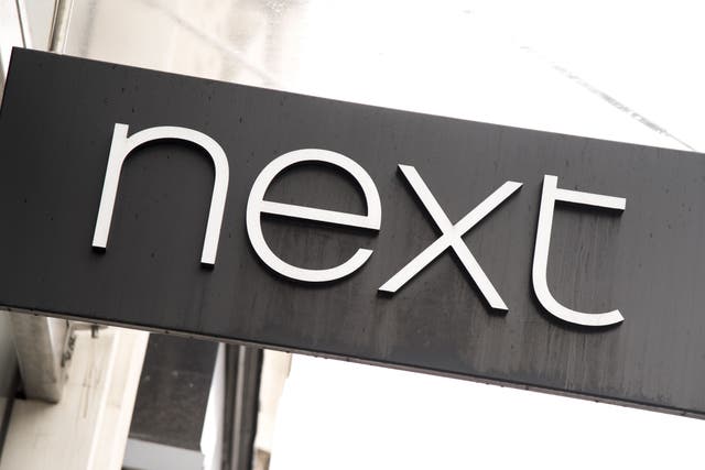 Fashion retailer Next has upgraded its profit and sales targets after revealing that warmer weather and continued wage increases have sparked a jump in sales in recent weeks (Ian West/PA)