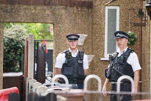 Police at the scene in Bedfont, Hounslow after the family were found dead (Lucy North/PA)