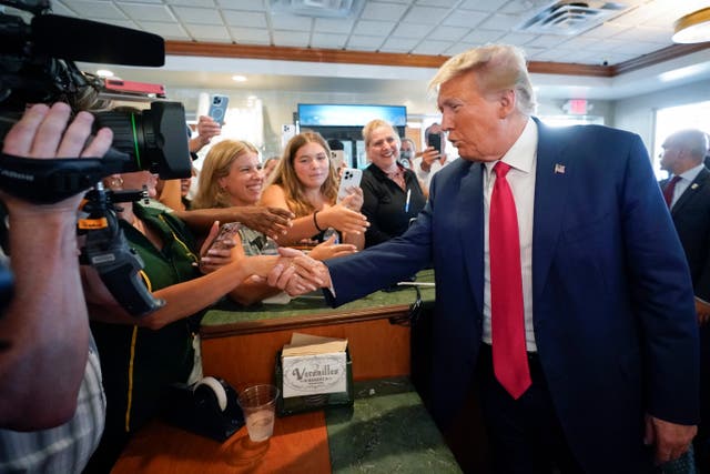 <p>Donald Trump greeting supporters </p>