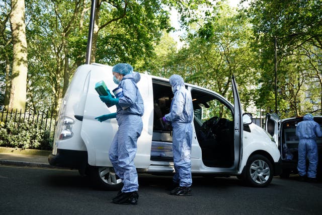 <p>Police forensics officers at the scene in Paddington Green in London</p>