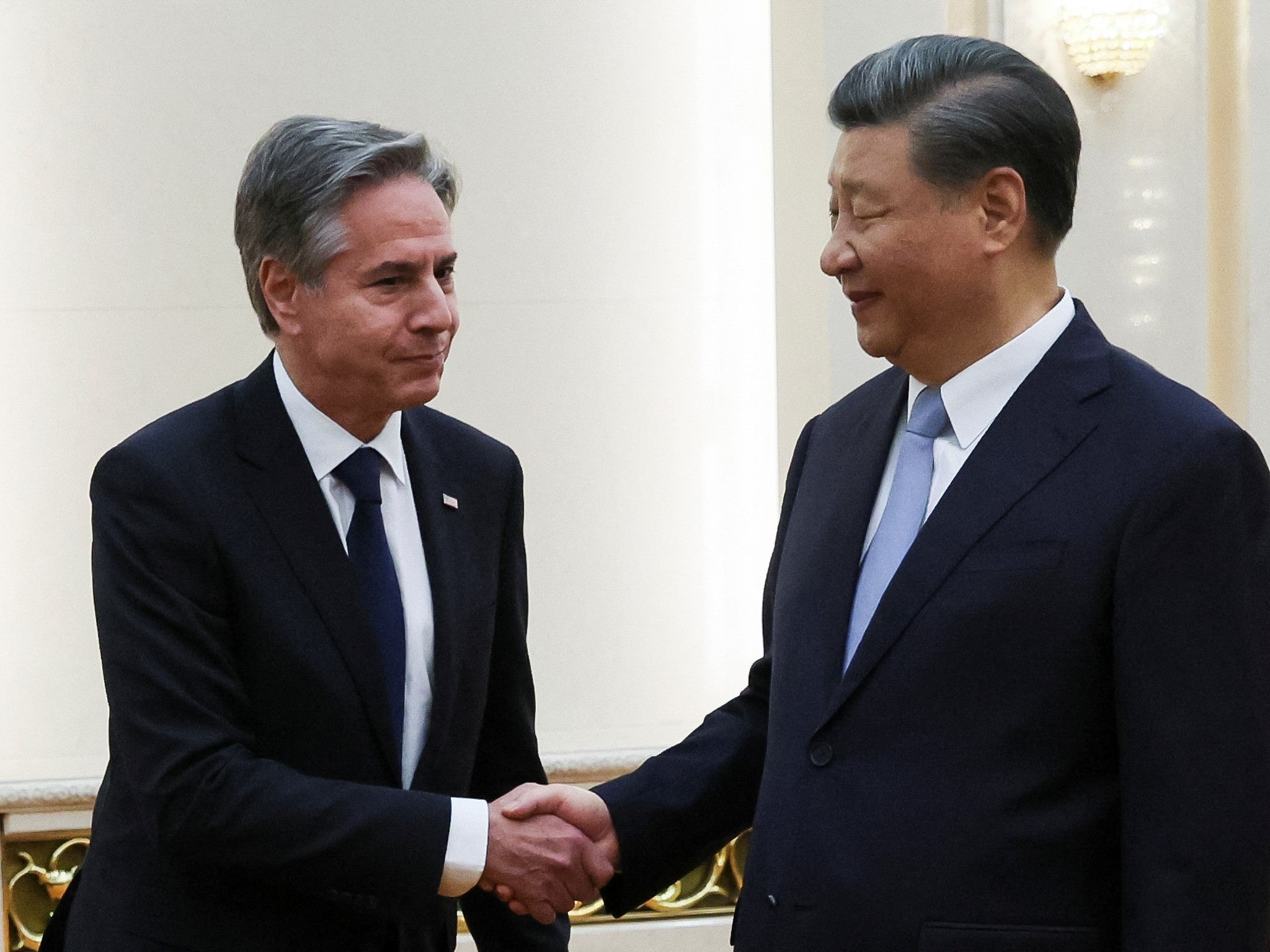 US Secretary of State Antony Blinken shakes hands with Chinese President Xi Jinping in the Great Hall of the People in Beijing