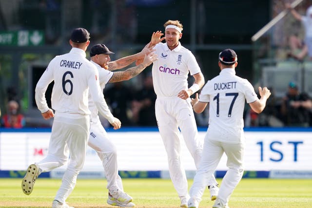 England’s Stuart Broad (second right) celebrates the wicket of Steve Smith (Nick Potts/PA).