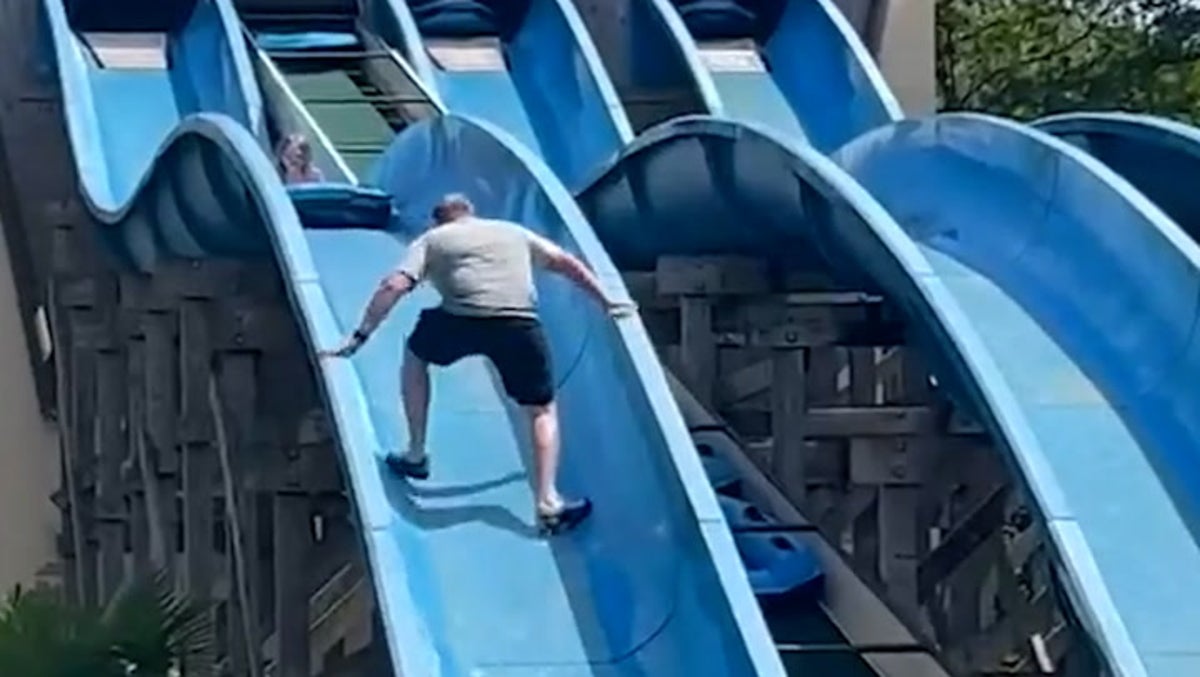 ‘Heroic’ father scales theme park water slide to rescue stuck daughter
