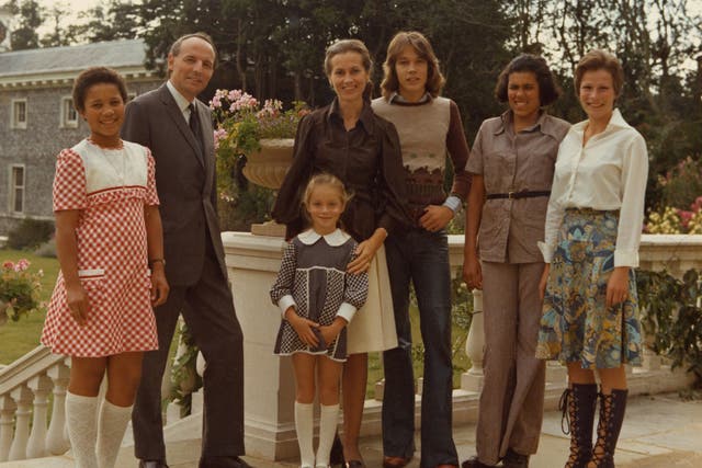 <p>Susan, the 10th Duchess of Richmond and Gordon (centre), with her family at Goodwood</p>