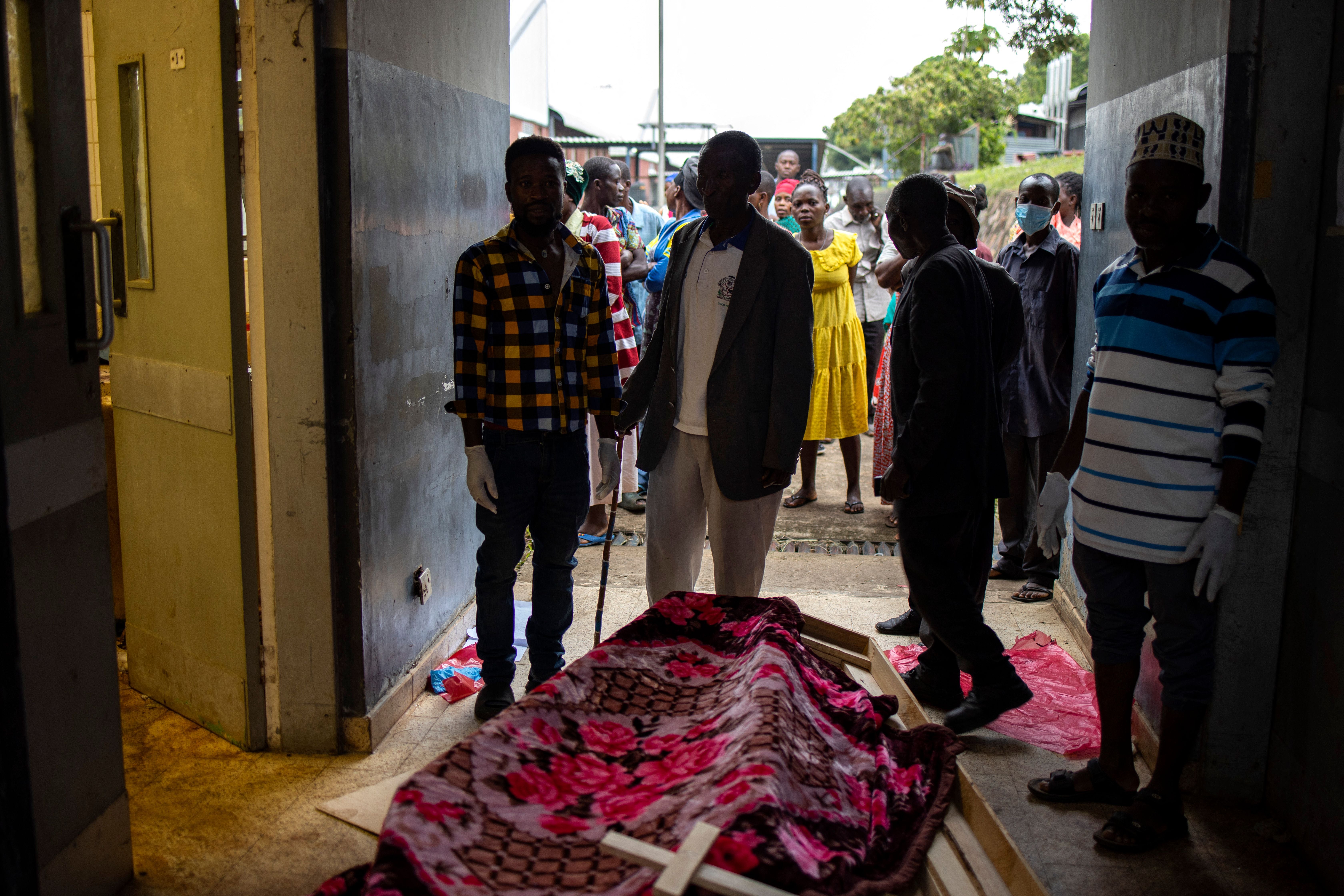 Relatives of victims of the Mpondwe Lhubiriha Secondary School gather at the Bwera General Hospital Mortuary, Kasese, on 18 June 2023