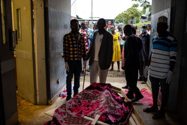 <p>Relatives of victims of the Mpondwe Lhubiriha Secondary School gather at the Bwera General Hospital Mortuary, Kasese, on 18 June 2023</p>