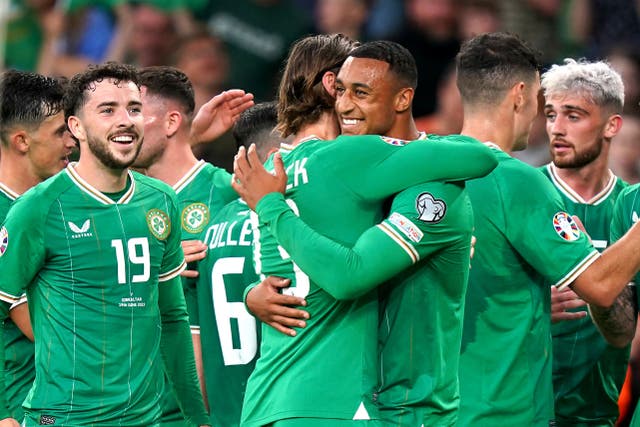 Republic of Ireland striker Adam Idah (centre) is congratulated by his team-mates after scoring his first senior international goal (Niall Carson/PA)