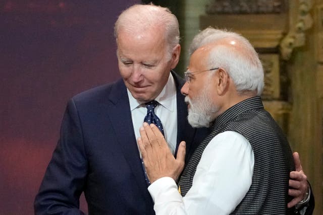 <p> US president Joe Biden, left, and India prime minister Narendra Modi talk during the G20 leaders summit in Bali</p>