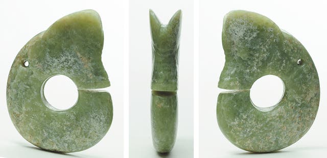 <p>A dragon-shaped jade item unearthed from Banlashan in Chaoyang city, Liaoning province. The site is one of the major archaeological findings of the Neolithic Hongshan Culture, which is renowned for its exquisite jades</p>