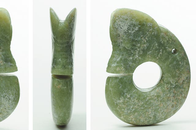<p>A dragon-shaped jade item unearthed from Banlashan in Chaoyang city, Liaoning province. The site is one of the major archaeological findings of the Neolithic Hongshan Culture, which is renowned for its exquisite jades</p>