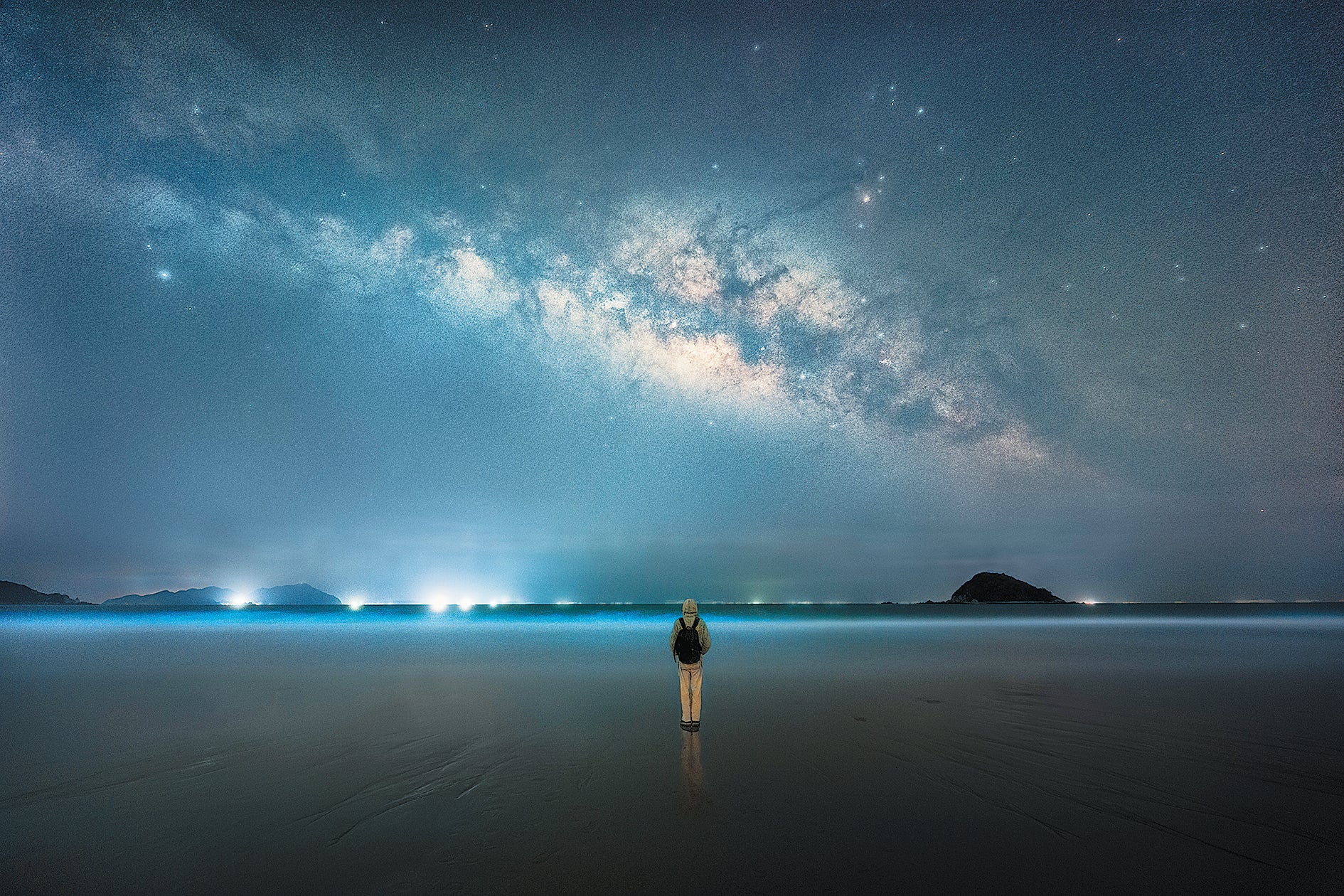 A night visitor to Xichong Beach in Shenzhen, Guangdong province, appreciates the sky