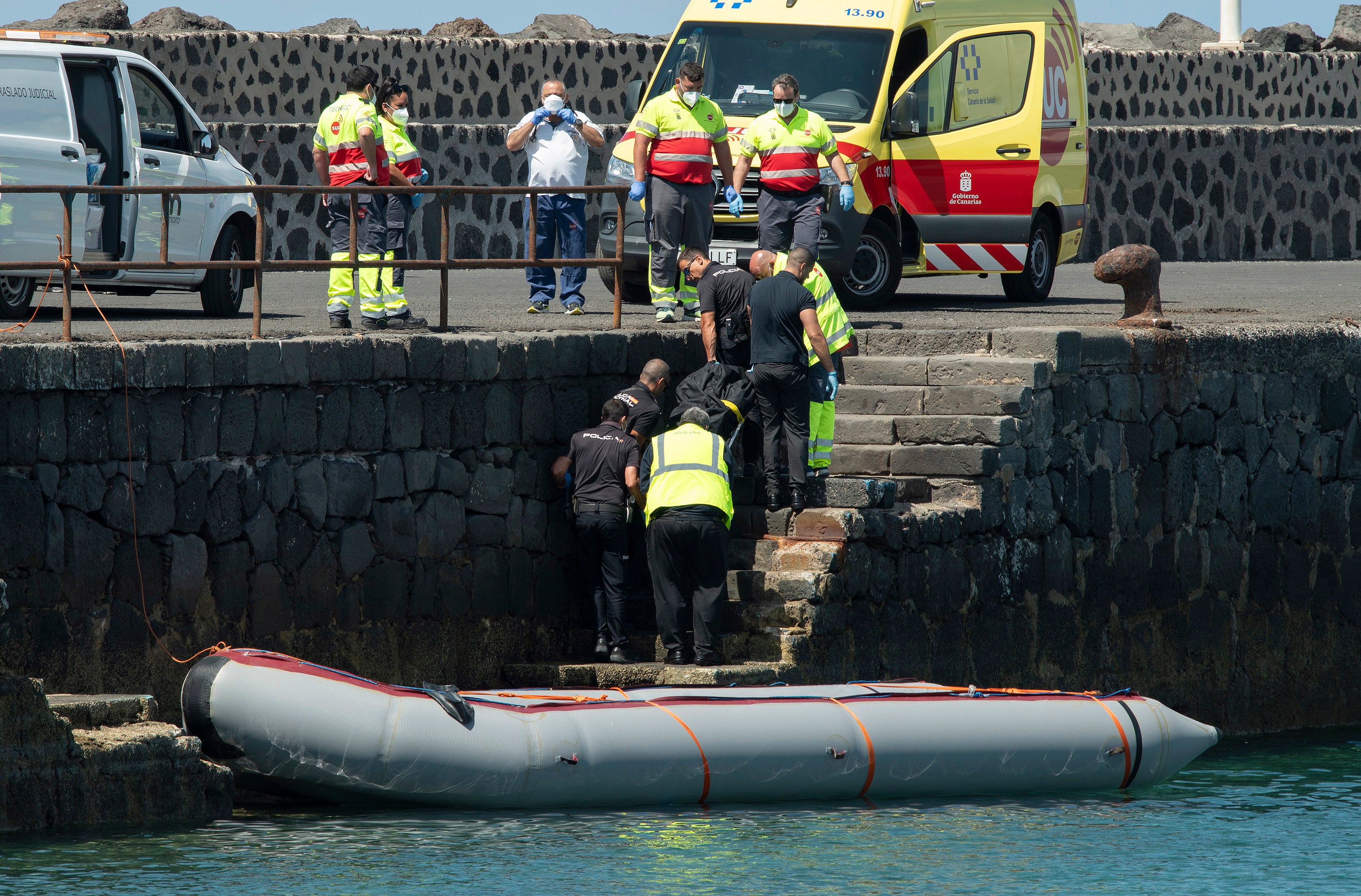 The body of a pregnant woman is taken ashore in Lanzarote, the Canaries on Tuesday