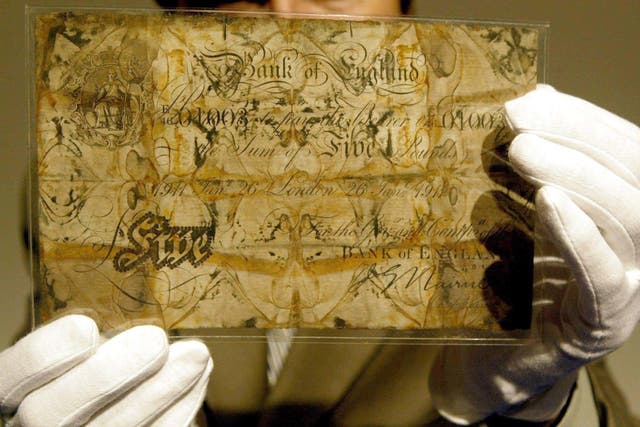 A five pound note, recovered from the wreck of the Titanic (Phil Noble/Archive/PA)