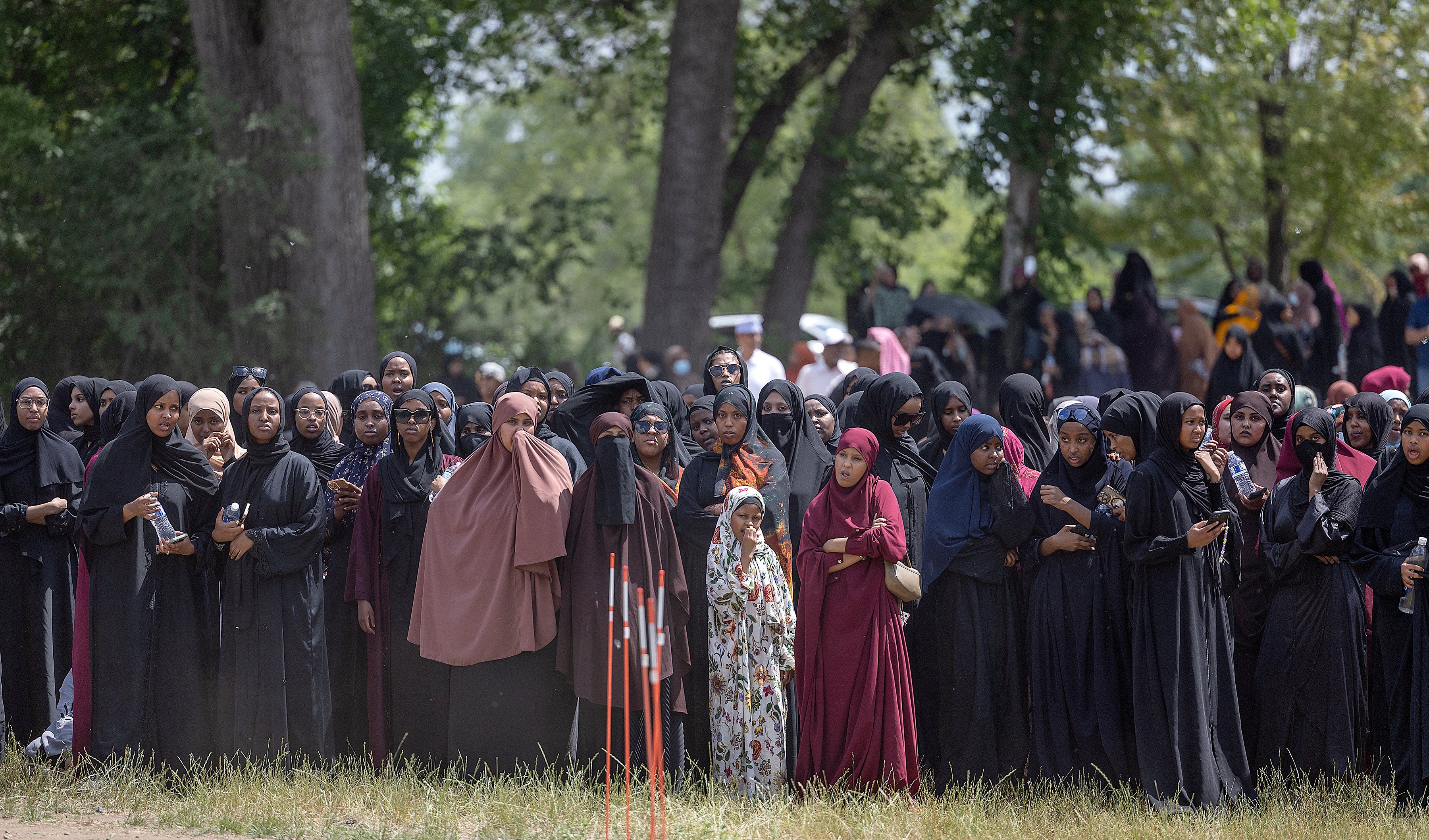 Crowds of women and men attend the funeral of the five people killed in a car crash on Lake Street, at the Garden of Eden Islamic Cemetery in Burnsville, Minn., on Monday, June 19, 2023.