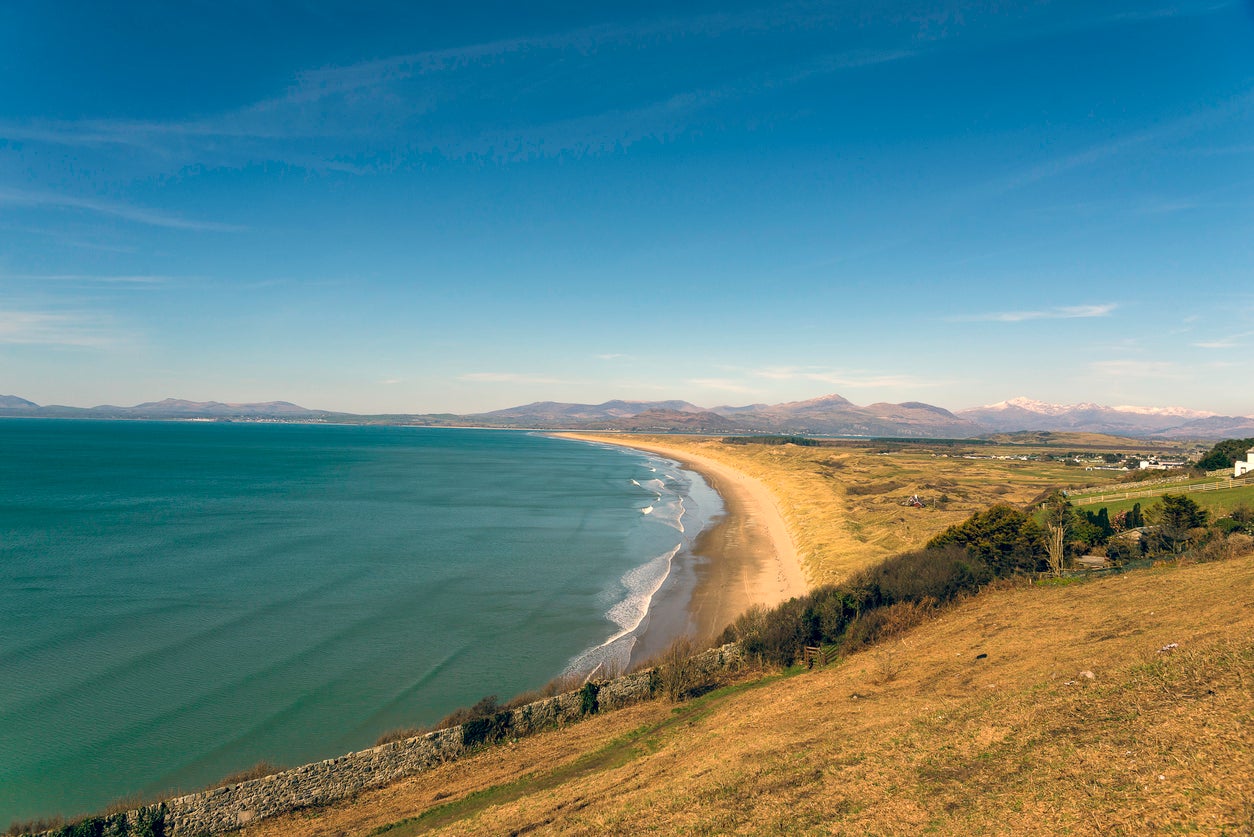 Harlech Beach is overlooked by Harlech Castle