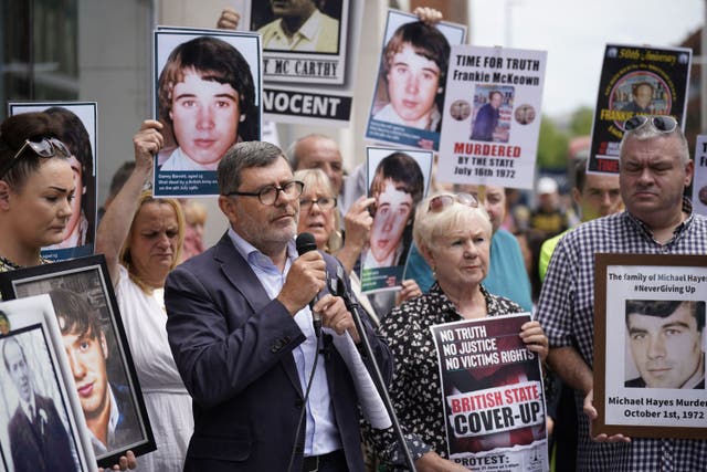 Mark Thompson, of Relatives For Justice, speaks during a protest outside the Northern Ireland Office in Belfast (Niall Carson/PA)