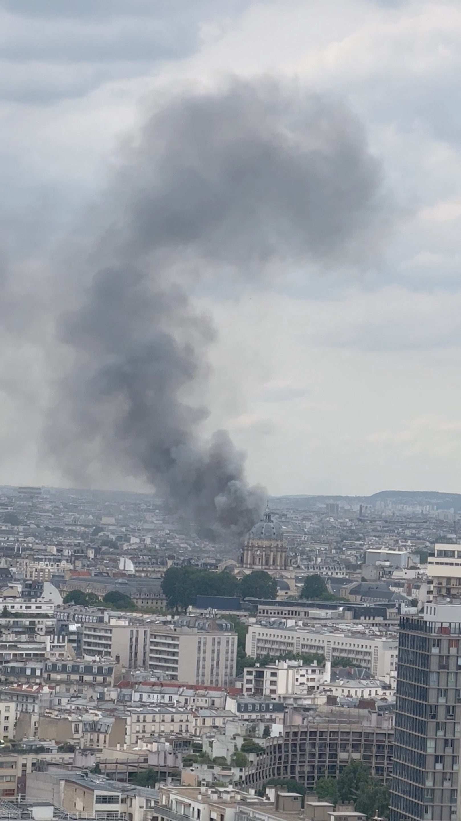 Smoke from the explosion curled up into the sky over the landmarks of Paris