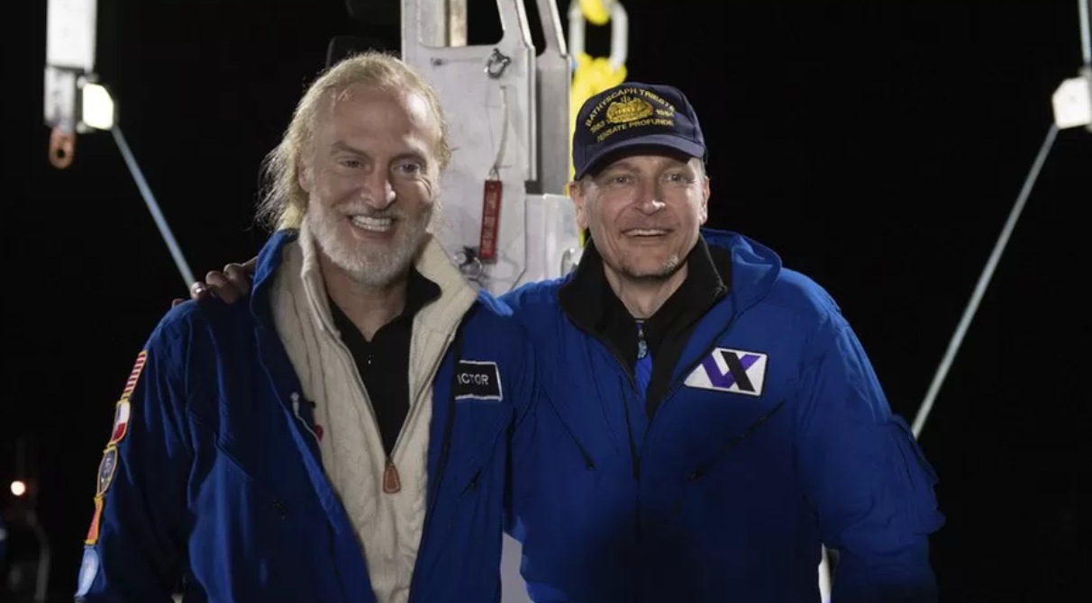 Victor Vescovo, left, and Kelly Walsh after returning from their dive to Challenger Deep in the Mariana Trench