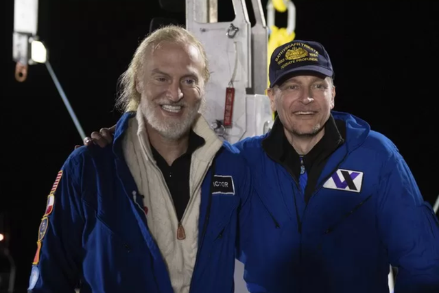 <p>Victor Vescovo, left, and Kelly Walsh after returning from their dive to Challenger Deep in the Mariana Trench</p>