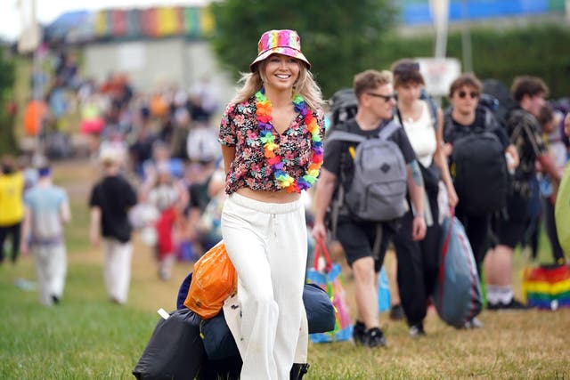 Initial bad weather does nothing to dampen spirits of Glastonbury festival-goers (Yui Mok/PA)