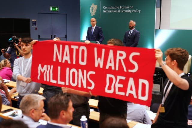 Tanaiste Micheal Martin looks on as protesters interrupt the opening session (Brian Lawless/PA)