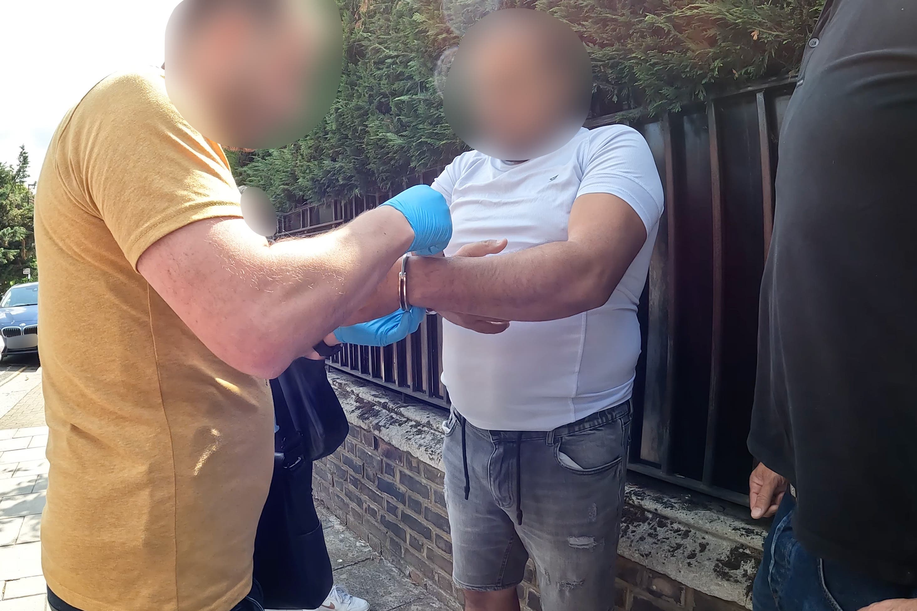 National Crime Agency officers arrested a man in west London (National Crime Agency/PA)