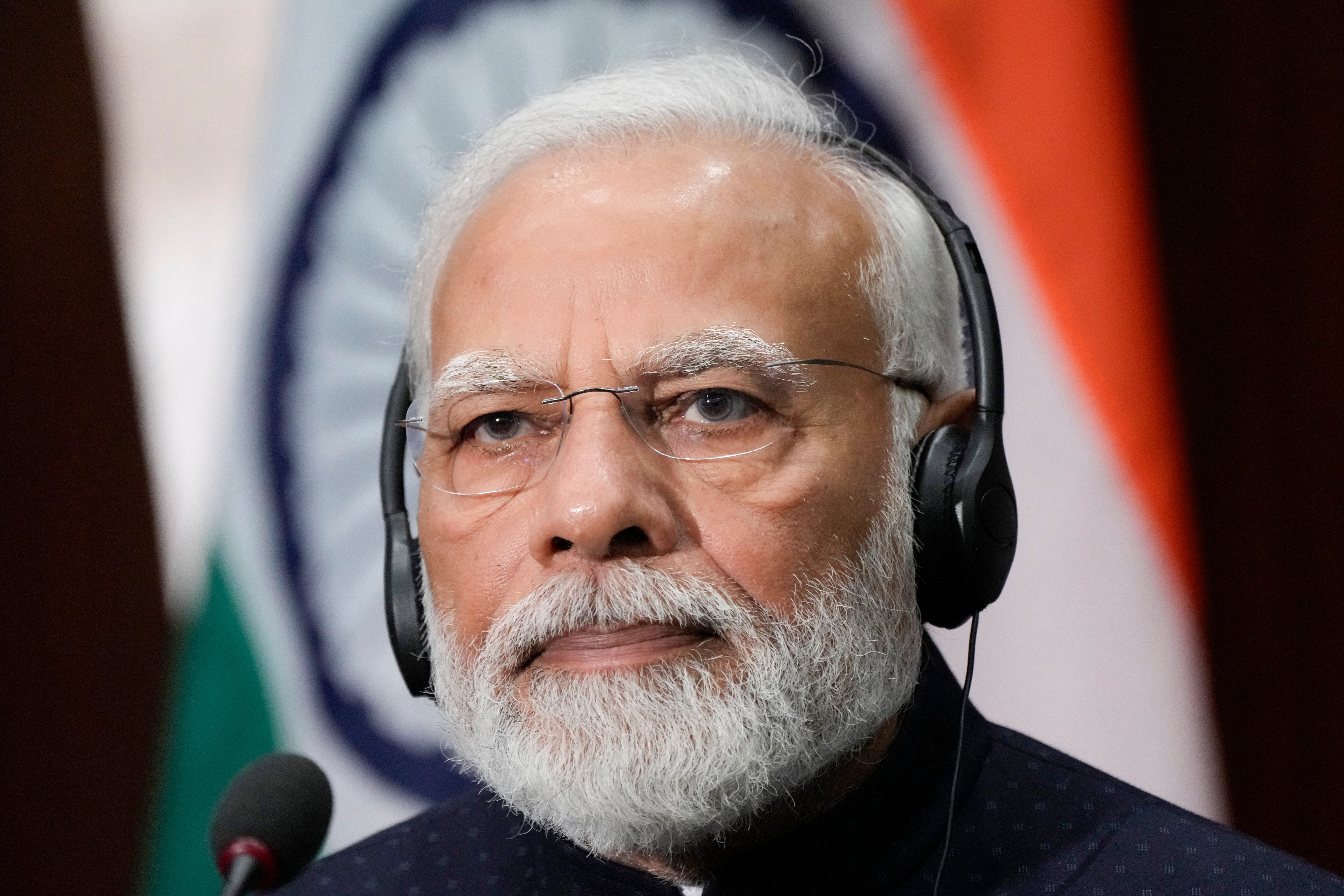 India's Prime Minister Narendra Modi listens as he visits the National Science Foundation in Alexandria