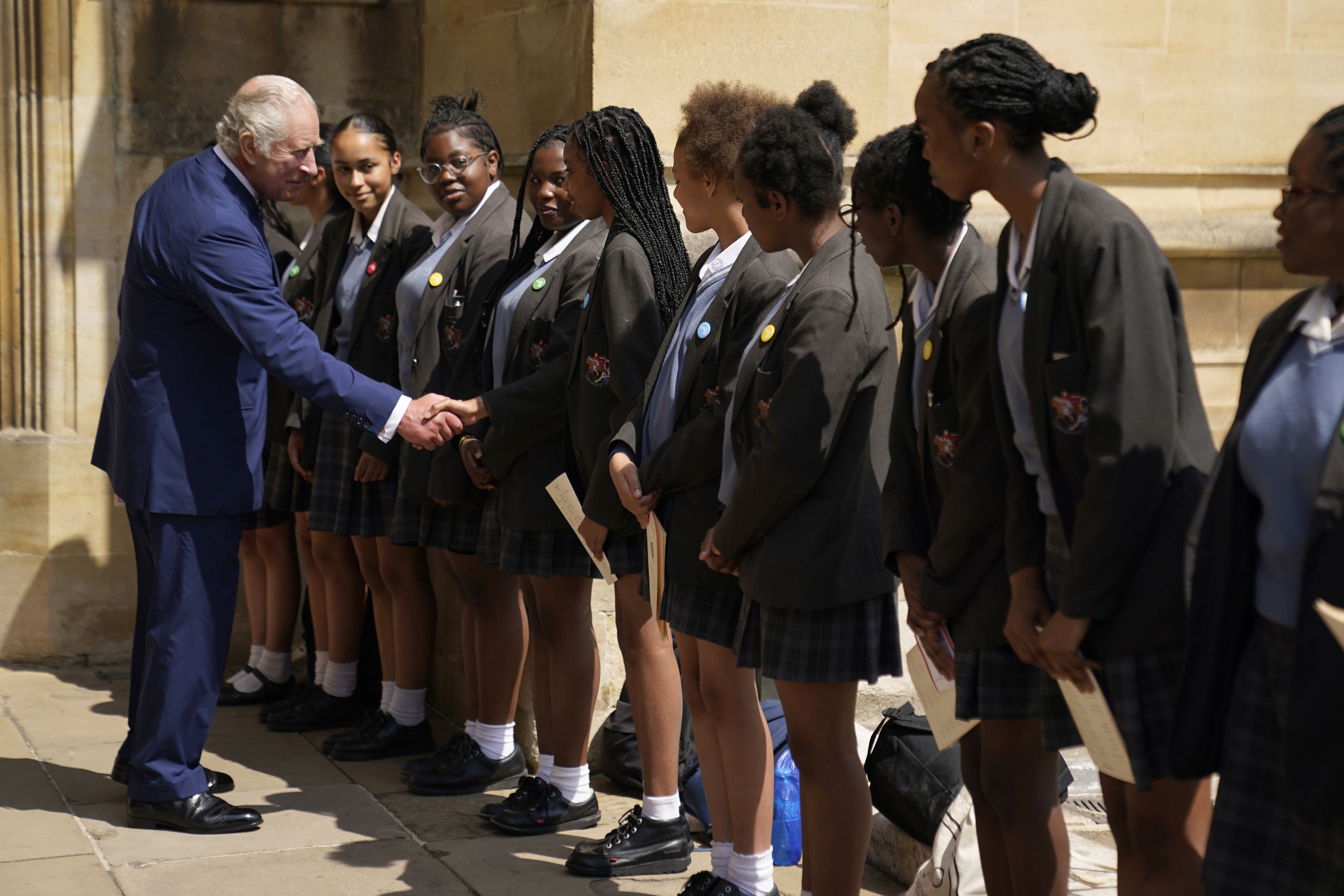 The King meets with members of the choir from the St Martin-in-the-Fields High School for Girls (Andrew Matthews/PA)