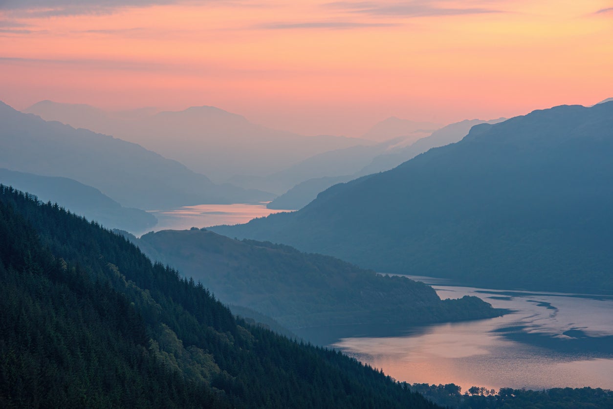 An early morning mist blocking sunrise over Loch Lomond in the Scottish Highlands