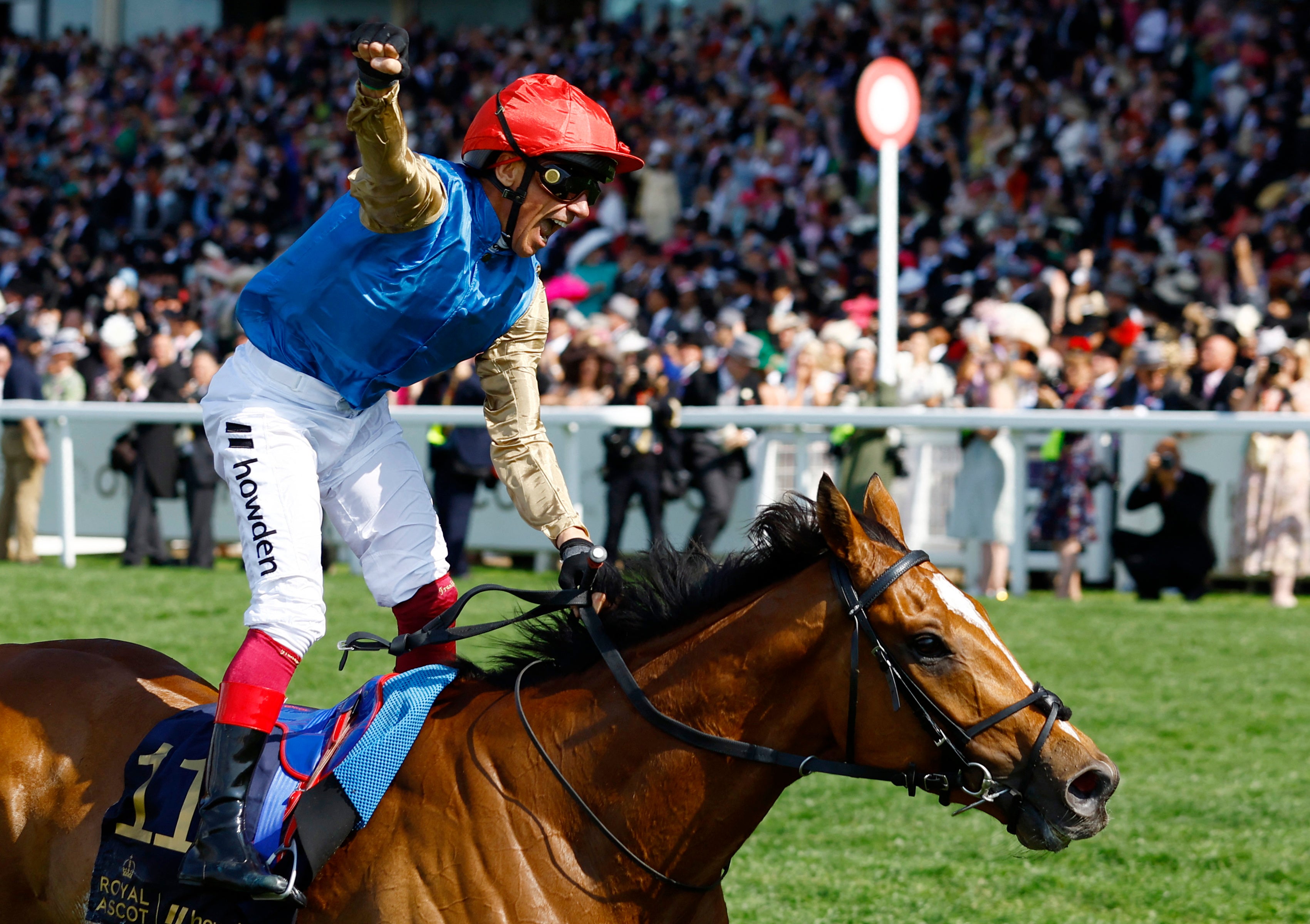 Frankie Dettori riding Courage Mon Ami celebrates after winning the gold cup