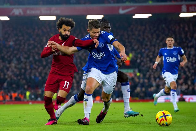Liverpool’s Mohamed Salah (left) and Everton’s James Tarkowski battle for the ball (Peter Byrne/PA).