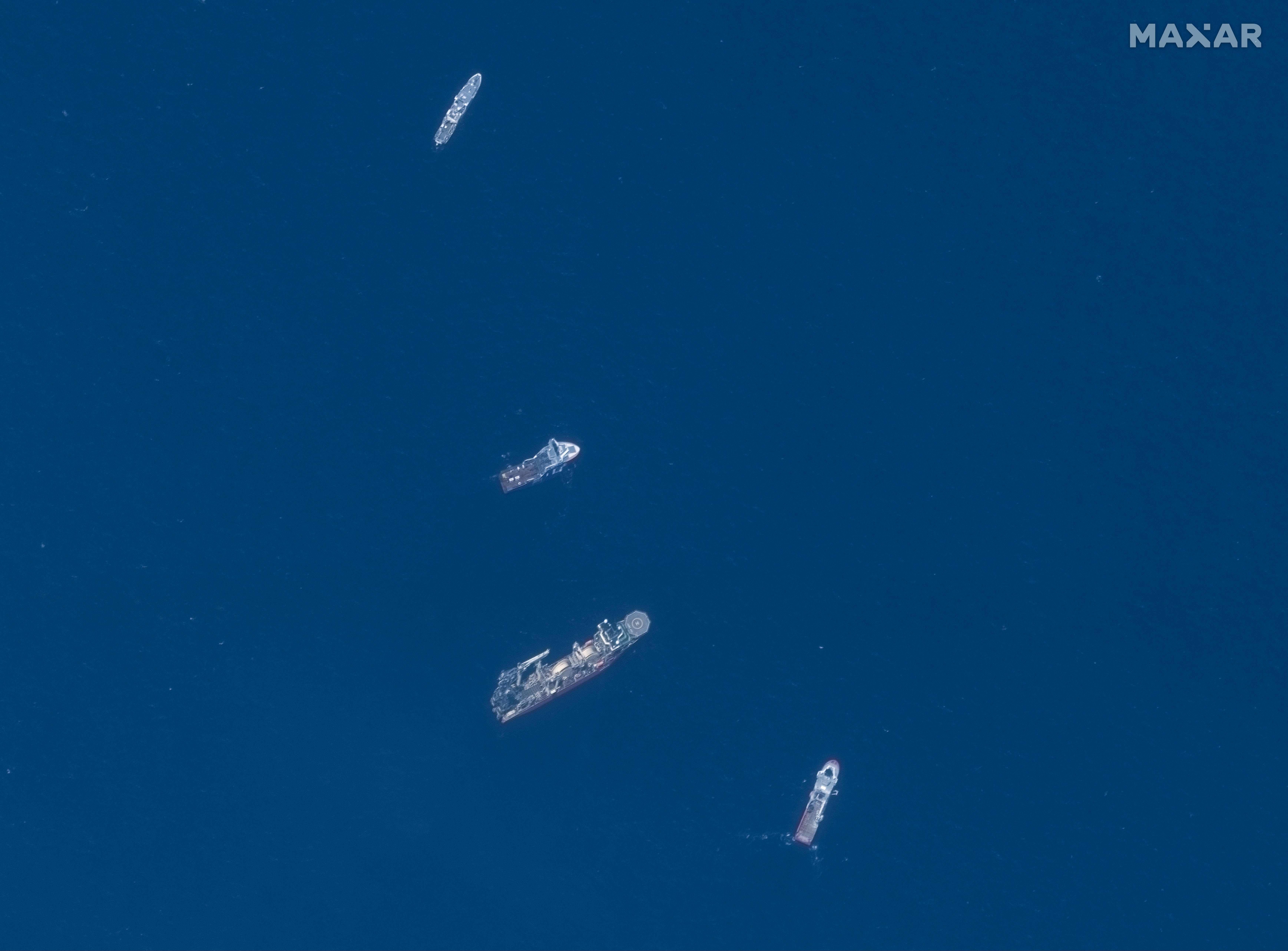 <p>This June 22, 2023, satellite image courtesy of Maxar Technologies shows the Horizon Arctic (2nd from top), Deep Energy (C) and Skandi Vinland (bottom) searching on Thursday for the missing Titan submersible</p>