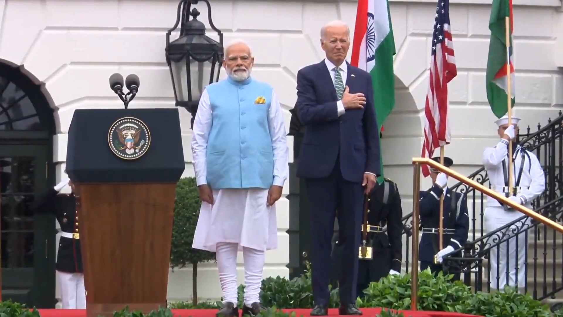 President Modi and President Biden listen to each nations national anthems