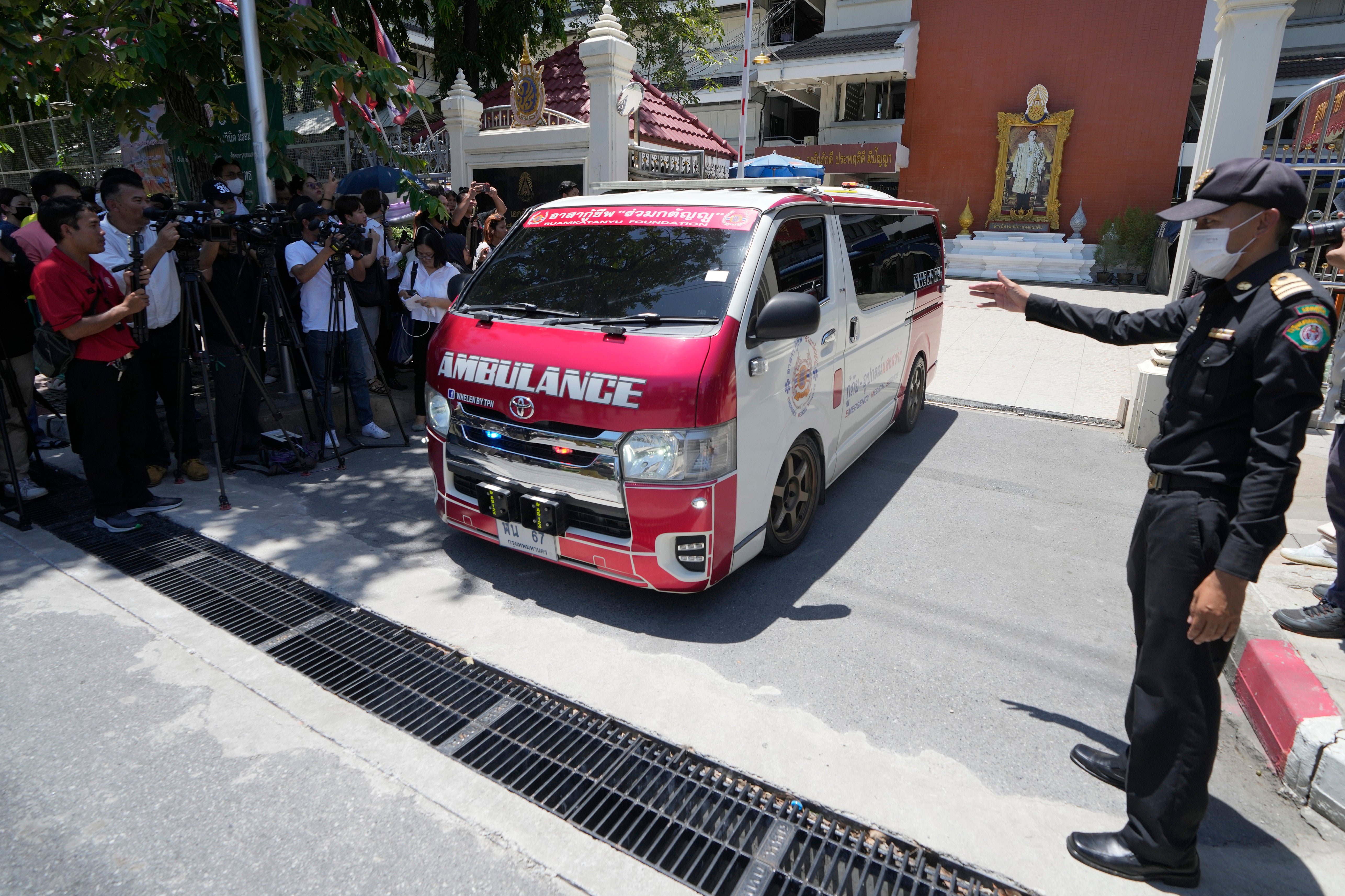 File An ambulance car carrying student leaves a high school for a hospital in Bangkok, Thailand