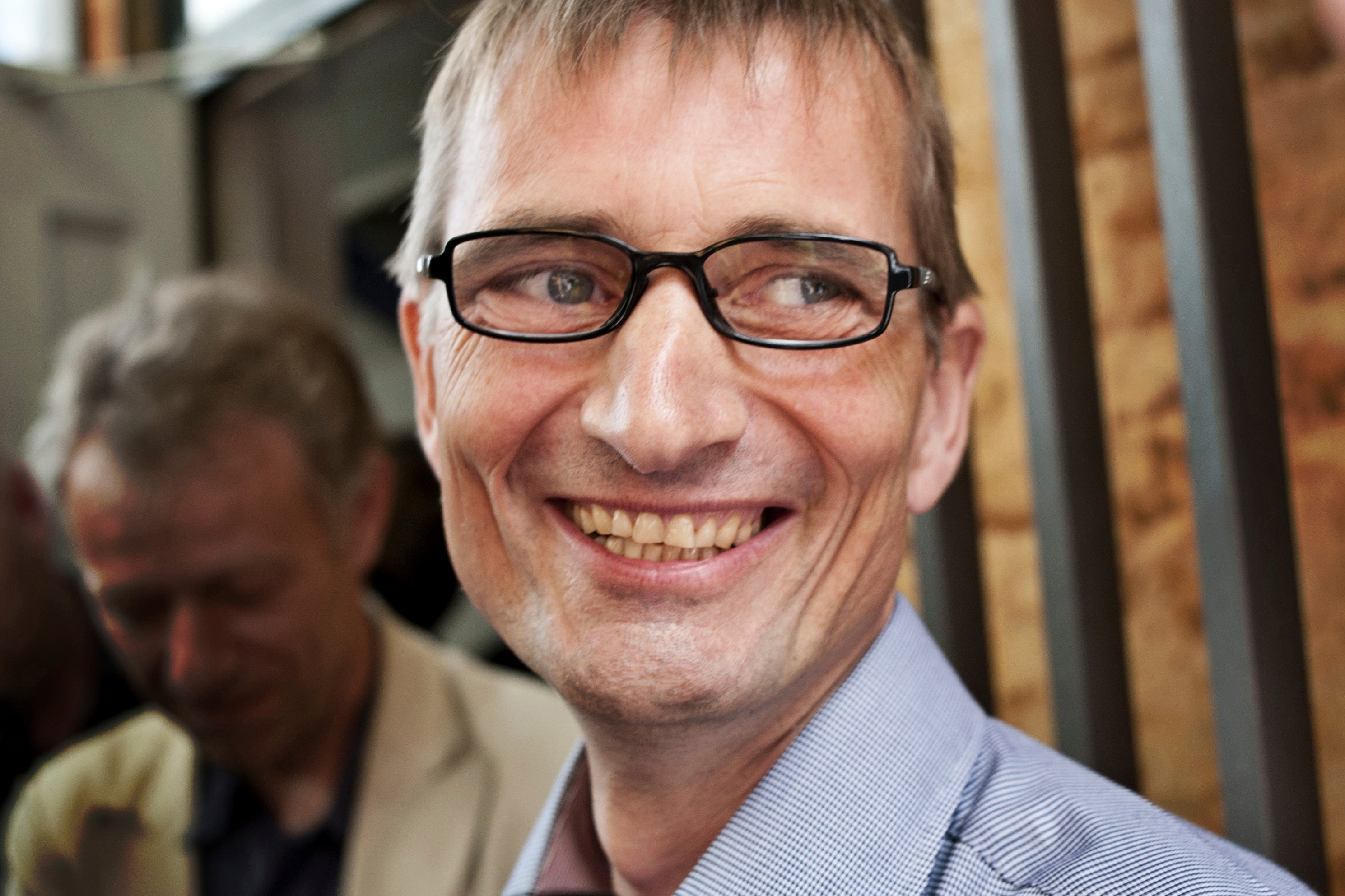 Niels Holck smiles outside the Eastern High Court in Copenhagen in 2011