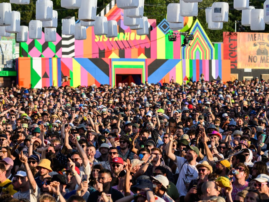 Festival-goers listen to Mike Skinner perform on Day 2 of Glastonbury Festival 2023