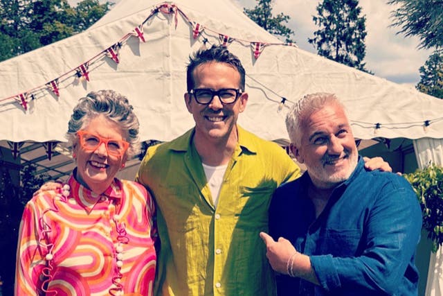 <p>Ryan Reynolds poses with Prue Leith and Paul Hollywood</p>
