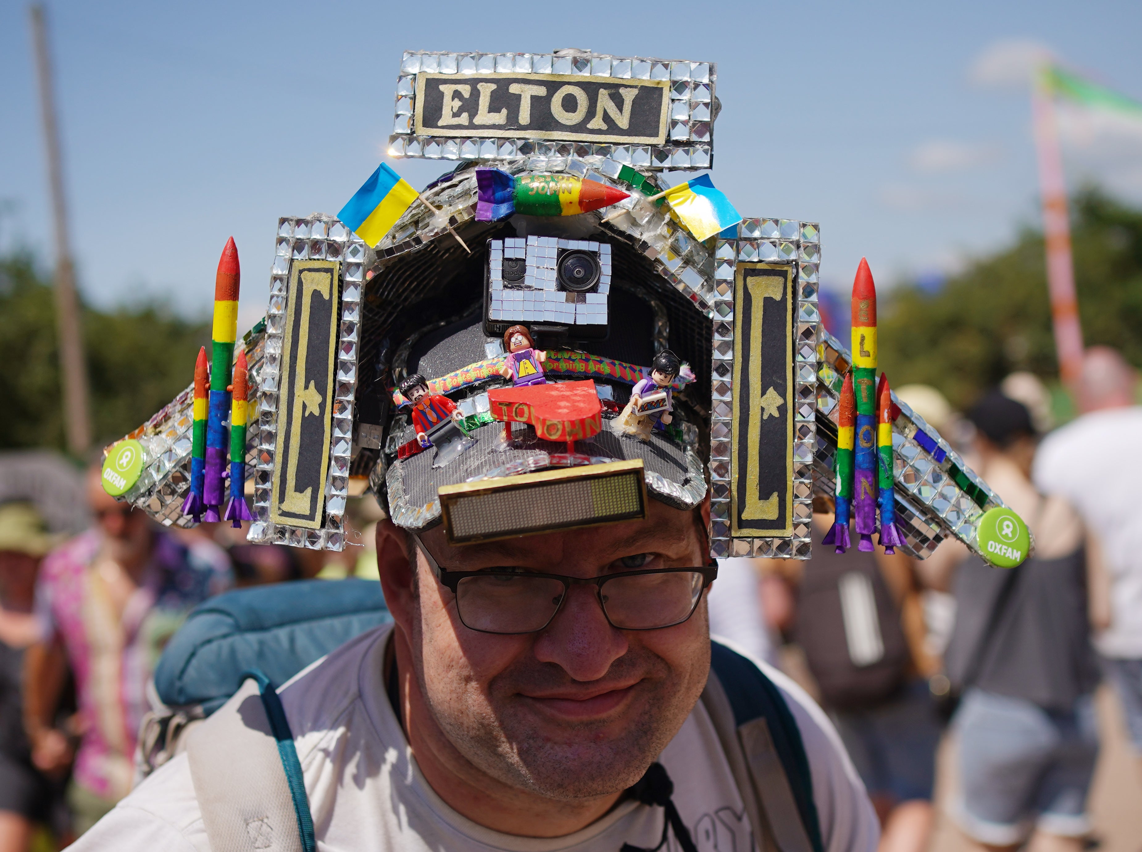 Festivalgoer Alex McGuire, from Taunton, wearing an Elton John Pyramid Stage hat at the Glastonbury Festival