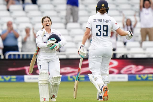 Tammy Beaumont, left, celebrates her century (Tim Goode/PA)