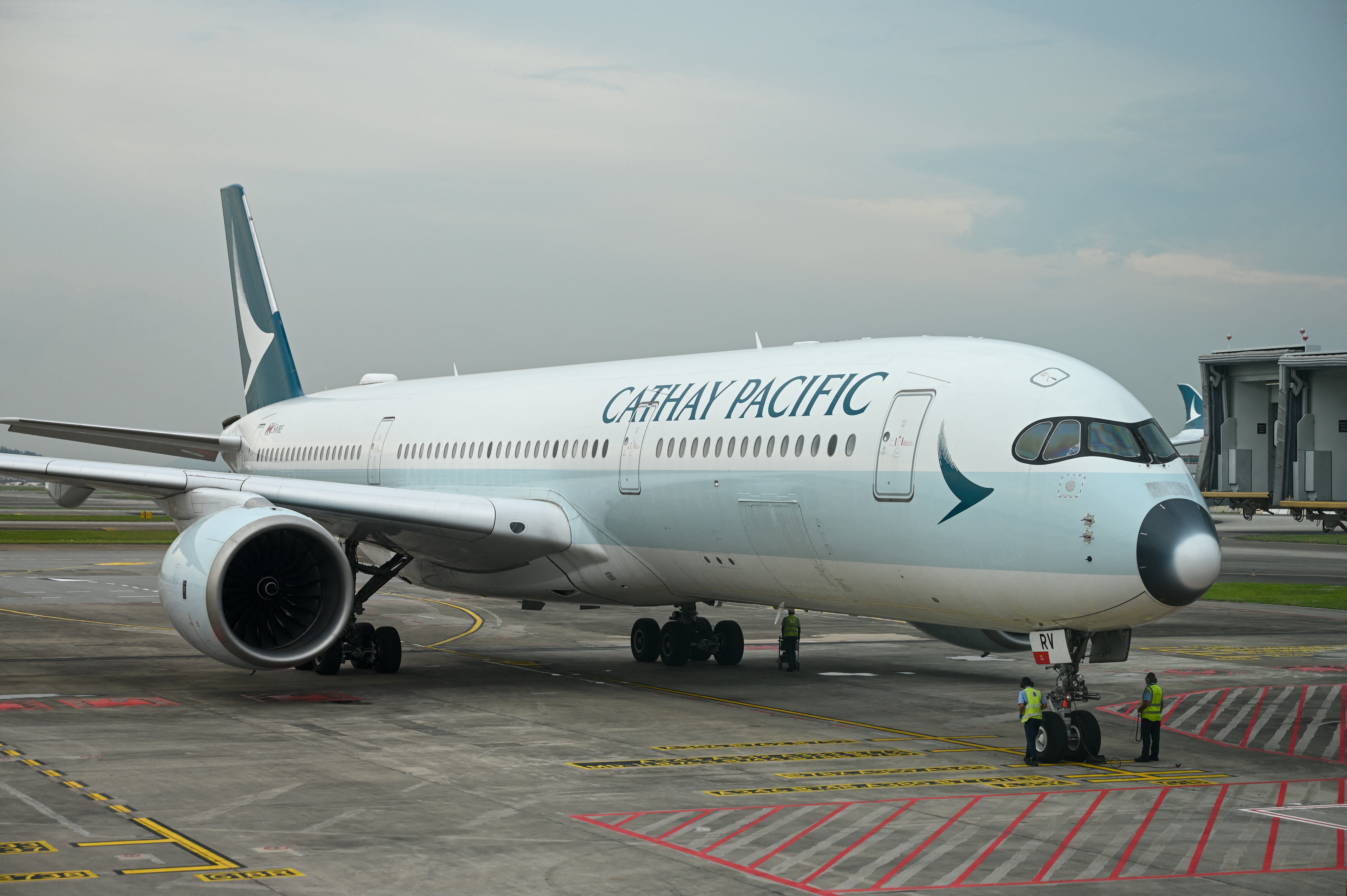 File image of a Cathay Pacific passenger plane arriving at Singapore’s Changi Airport Terminal 4 on 13 September 2022