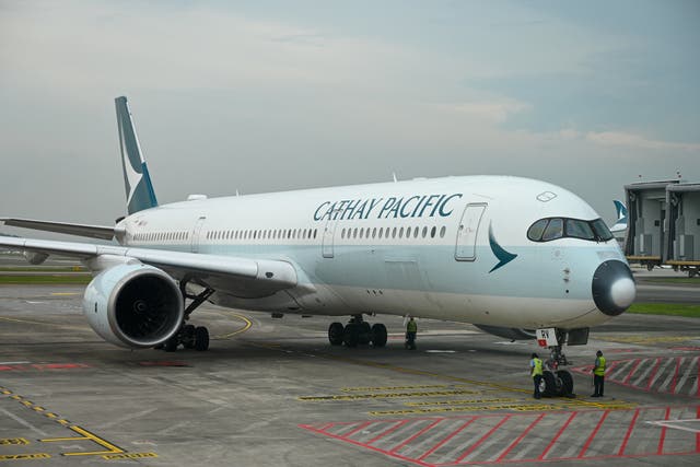<p>File image of a Cathay Pacific passenger plane arriving at Singapore’s Changi Airport Terminal 4 on 13 September 2022 </p>