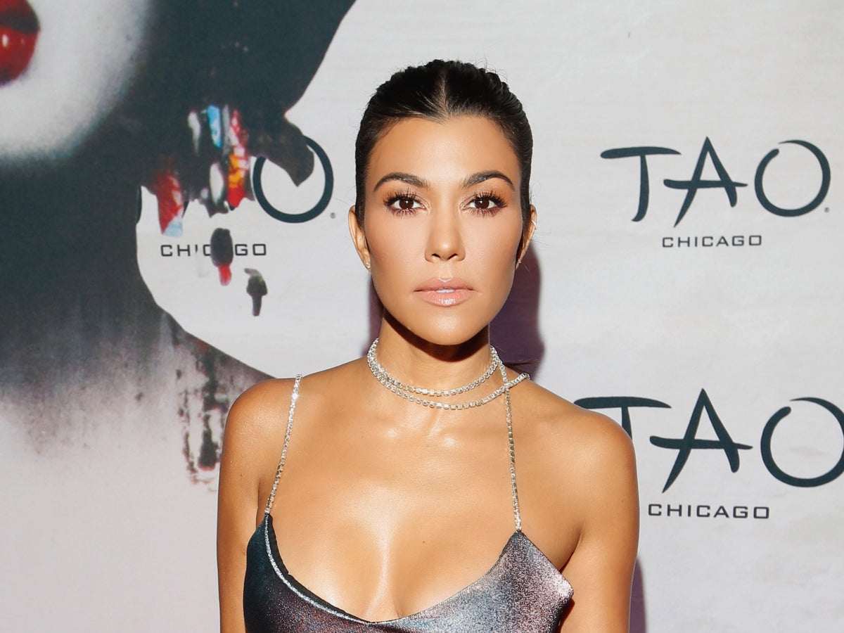 Kourtney Kardashian shows off baby bump as fans speculate about due date
