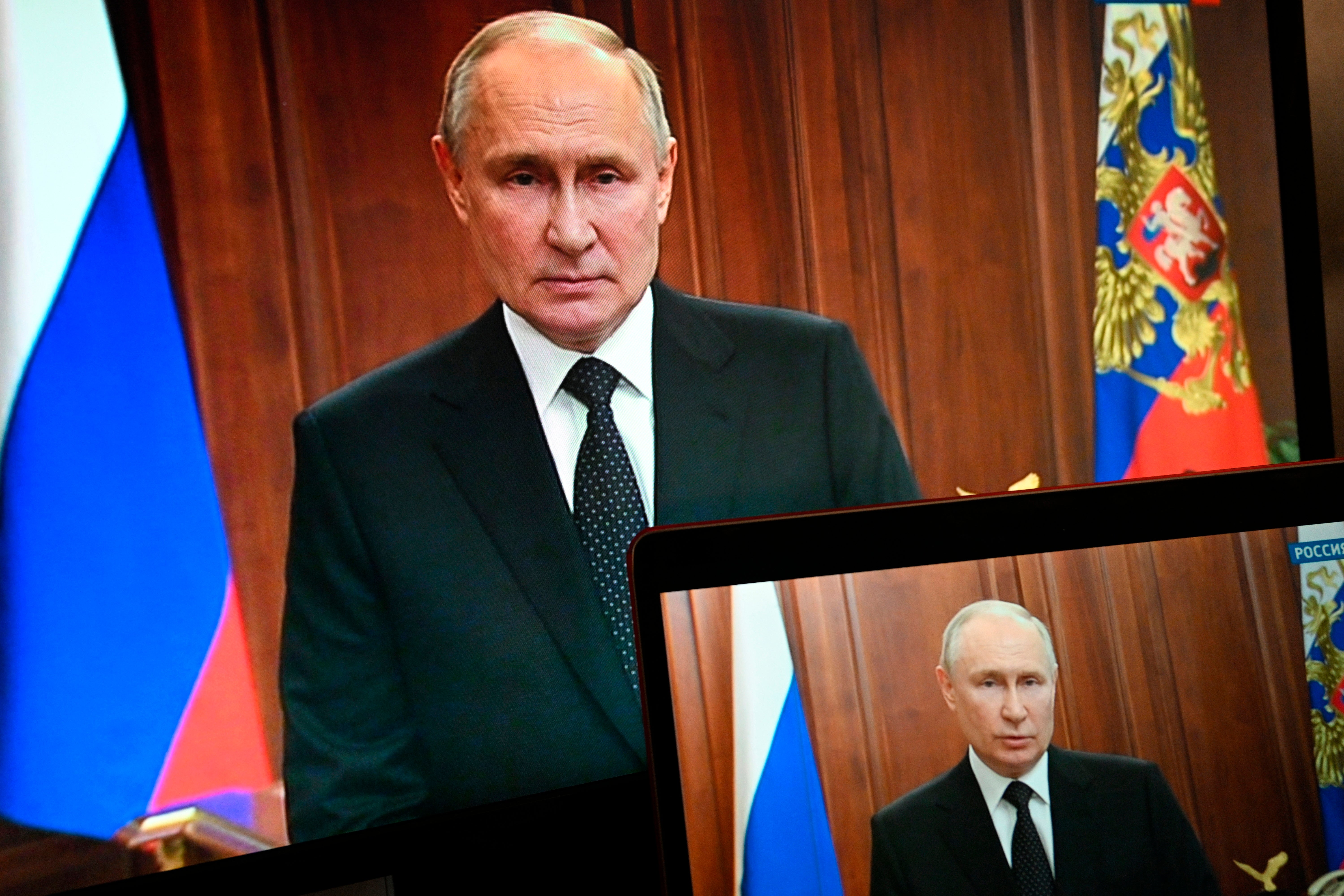 Russian President Vladimir Putin is seen on monitors as he addresses the nation after Yevgeny Prigozhin, the owner of the Wagner Group military company, called for armed rebellion and reached the southern city of Rostov-on-Don with his troops, in Moscow. (Pavel Bednyakov, Sputnik, Kremlin Pool Photo via AP)